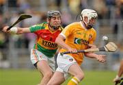 25 June 2011; Karl Stewart, Antrim, in action against Eoin Nolan, Carlow. GAA Hurling All-Ireland Senior Championship Phase 1, Antrim v Carlow, Casement Park, Belfast, Co. Antrim. Picture credit: Oliver McVeigh / SPORTSFILE