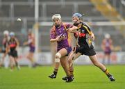 25 June 2011; Kate Kelly, Wexford, in action against Claire Phelan, Kilkenny. All-Ireland Senior Camogie Championship Round 3 in association with RTE Sport, Wexford v Kilkenny, Wexford Park, Co. Wexford. Picture credit: Barry Cregg / SPORTSFILE