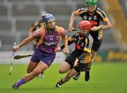 25 June 2011; Katriona Parrock, Wexford, in action against Jacquie Frisby, Kilkenny. All-Ireland Senior Camogie Championship Round 3 in association with RTE Sport, Wexford v Kilkenny, Wexford Park, Co. Wexford. Picture credit: Barry Cregg / SPORTSFILE