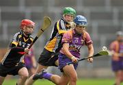 25 June 2011; Katriona Parrock, Wexford, in action against Denise Gaule, centre, and Jacquie Frisby, left, Kilkenny. All-Ireland Senior Camogie Championship Round 3 in association with RTE Sport, Wexford v Kilkenny, Wexford Park, Co. Wexford. Picture credit: Barry Cregg / SPORTSFILE