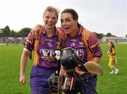 25 June 2011; Evelyn Quigly, left, and Ursla Jacob, right, Wexford, celebrate victory after the game. All-Ireland Senior Camogie Championship Round 3 in association with RTE Sport, Wexford v Kilkenny, Wexford Park, Co. Wexford. Picture credit: Barry Cregg / SPORTSFILE