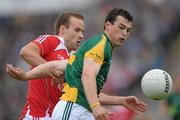 25 June 2011; Paddy O'Rourke, Meath, in action against Michael Faning, Louth. GAA Football All-Ireland Senior Championship Qualifier Round 1, Louth v Meath, Kingspan Breffni Park, Co. Cavan. Photo by Sportsfile
