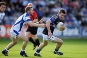 25 June 2011; Barry Grogan, Tipperary, in action against Cahir Healy, Laois. GAA Football All-Ireland Senior Championship Qualifier Round 1, Laois v Tipperary, O'Moore Park, Portlaoise, Co. Laois. Picture credit: Brendan Moran / SPORTSFILE