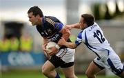 25 June 2011; Seamus Grogan, Tipperary, in action against Niall Donoher, Laois. GAA Football All-Ireland Senior Championship Qualifier Round 1, Laois v Tipperary, O'Moore Park, Portlaoise, Co. Laois. Picture credit: Brendan Moran / SPORTSFILE