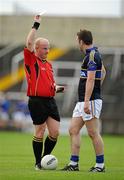 25 June 2011; Barry Grogan, Tipperary, is shown a yellow card by referee Maurice Condon. GAA Football All-Ireland Senior Championship Qualifier Round 1, Laois v Tipperary, O'Moore Park, Portlaoise, Co. Laois. Picture credit: Brendan Moran / SPORTSFILE