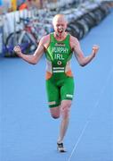 25 June 2011; Ireland's Conor Murphy, from Portadown, Co. Armagh, celebrates taking 38th position on the approach to the finish line during the Elite Men's race. 2011 Pontevedra ETU Triathlon European Championships - Elite Men, Pontevedra, Spain. Picture credit: Stephen McCarthy / SPORTSFILE