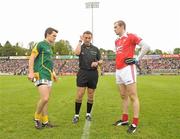25 June 2011; Meath captain Seamus Kenny and Louth captain Paddy keenan look on as referee Maurice Deegan tosses the coin before the game. GAA Football All-Ireland Senior Championship Qualifier Round 1, Louth v Meath, Kingspan Breffni Park, Co. Cavan. Photo by Sportsfile