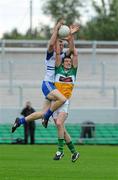 25 June 2011; Owen Lennon, Monaghan, contests a high ball against Niall Smith, Offaly. GAA Football All-Ireland Senior Championship Qualifier Round 1, Offaly v Monaghan, O'Connor Park, Tullamore, Co. Offaly. Picture credit: Dáire Brennan / SPORTSFILE