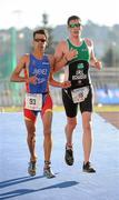 25 June 2011; Ireland's Ian Richardson, from Higginstown, Slane, Co. Meath, tussles with Jesús Jiménez Fueyo, Spain, for position, on his way to taking 5th position in the 20-24 Male Age Group Sprint event, with a time of 01:09:07, at the 2011 Pontevedra ETU Triathlon European Championships. Pontevedra, Spain. Picture credit: Stephen McCarthy / SPORTSFILE
