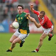 25 June 2011; Peadar Byrne, Meath, in action against Jamie Queeney, Louth. GAA Football All-Ireland Senior Championship Qualifier Round 1, Louth v Meath, Kingspan Breffni Park, Co. Cavan. Picture credit: David Maher / SPORTSFILE