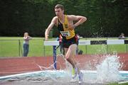 26 June 2011; John Fitzpatrick, from Kilkenny City Harriers, clears the water jump on his way to winning the Junior Men 3000m Steeplechase race during the Woodie’s DIY Junior and U23 Championships. Tullamore Harriers AC, Tullamore, Co. Offaly. Picture credit: Barry Cregg / SPORTSFILE