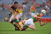 26 June 2011; Brendan Murphy, Carlow, in action against Joey Wadding, hidden, and Daithi Waters, left, Wexford. Leinster GAA Football Senior Championship Joey Wadding, no.2 and Daithi WatersSemi-Final, Wexford v Carlow, Croke Park, Dublin. Picture credit: David Maher / SPORTSFILE