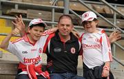 26 June 2011; Tyrone supporters Phillip Gervin senior, centre, Phillip Gervin junior and Eimear Gervin, right, from Coalisland, Co. Tyrone. Ulster GAA Football Senior Championship Semi-Final, Tyrone v Donegal, St Tiernach's Park, Clones, Co. Monaghan. Picture credit: Oliver McVeigh / SPORTSFILE