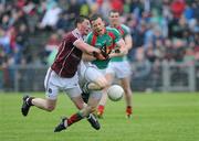 26 June 2011; Donal Vaughan, Mayo, is tackled by Gareth Bradshaw, Galway. Connacht GAA Football Senior Championship Semi-Final, Mayo v Galway, McHale Park, Castlebar, Co. Mayo. Picture credit: Matt Browne / SPORTSFILE