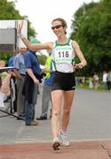 26 June 2011; Olive Loughnane, Loughrea A.C., Co. Galway, crosses the finish line to finish second in the Women's 20k race at the 18th Dublin International Grand Prix of Race Walking. Furze Road, Phoenix Park, Co. Dublin. Picture credit: Pat Murphy / SPORTSFILE