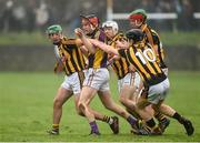 29 January 2017; Diarmuid O'Keeffe of Wexford in action against Conor Martin, JonJo Farrell, Pat Lyng and Alan Murphy of Kilkenny during the Bord na Mona Walsh Cup Semi-Final match between Wexford and Kilkenny at O'Kennedy Park in New Ross, Co Wexford. Photo by Matt Browne/Sportsfile