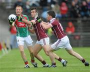26 June 2011; Richie Feeney, Mayo, in action against Paul Conroy and Gareth Bradshaw, right, Galway. Connacht GAA Football Senior Championship Semi-Final, Mayo v Galway, McHale Park, Castlebar, Co. Mayo. Picture credit: Ray Ryan / SPORTSFILE