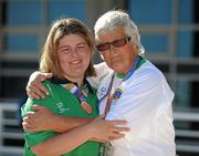 26 June 2011; Team Ireland swimmer Aisling Beacom, Wicklow, Co. Wicklow, is congratulated by her mother Pam after winning the first medal for Team Ireland, a bronze in the 800m freestyle, at the OAKA Olympic Aquatic Center, Athens Olympic Sport Complex. 2011 Special Olympics World Summer Games, Athens, Greece. Picture credit: Ray McManus / SPORTSFILE