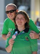 26 June 2011; Team Ireland swimmer Aisling Beacom, Wicklow, Co. Wicklow, after winning the first medal for Team Ireland, a bronze in the 800m freestyle, with her brother Shane, who flew in from New Jersey to see the final, at the OAKA Olympic Aquatic Center, Athens Olympic Sport Complex. 2011 Special Olympics World Summer Games, Athens, Greece. Picture credit: Ray McManus / SPORTSFILE