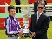 26 June 2011; Jockey Colm O'Donoghue, left, and trainer Aidan O'Brien celebrate with the trophy after Treasure Beach won the Dubai Duty Free Irish Derby (Group 1). Horse Racing, The Curragh Racecourse, Co. Kildare. Picture credit: Pat Murphy / SPORTSFILE
