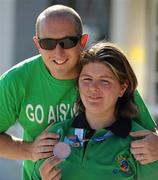 26 June 2011; Team Ireland swimmer Aisling Beacom, Wicklow Town, Co. Wicklow, after winning the first medal for Team Ireland, a bronze in the 800m freestyle, with her brother Shane, who flew in from New Jersey to see the final, at the OAKA Olympic Aquatic Center, Athens Olympic Sport Complex. 2011 Special Olympics World Summer Games, Athens, Greece. Picture credit: Ray McManus / SPORTSFILE