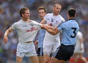 26 June 2011; Kildare's Eoghan O'Flaherty, left, and Ronan Sweeney clash with Rory O'Carroll, Dublin, resulting with Ronan Sweeney, receiving a yellow card from referee Cormac Reilly. Leinster GAA Football Senior Championship Semi-Final, Dublin v Kildare, Croke Park, Dublin. Picture credit: David Maher / SPORTSFILE