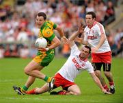 26 June 2011; Michael Murphy, Donegal, in action against Ryan McMenamin and Martin Swift, right, Tyrone. Ulster GAA Football Senior Championship Semi-Final, Tyrone v Donegal, St Tiernach's Park, Clones, Co. Monaghan. Picture credit: Michael Cullen / SPORTSFILE