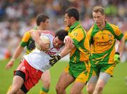 26 June 2011; Davy Harte, Tyrone, in action against Frank McGlynn and Anthony Thompson, right, Donegal. Ulster GAA Football Senior Championship Semi-Final, Tyrone v Donegal, St Tiernach's Park, Clones, Co. Monaghan. Picture credit: Michael Cullen / SPORTSFILE