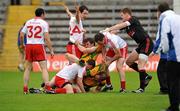 26 June 2011; Tyrone and Donegal players involved in an altercation during the game. Ulster GAA Football Senior Championship Semi-Final, Tyrone v Donegal, St Tiernach's Park, Clones, Co. Monaghan. Picture credit: Michael Cullen / SPORTSFILE