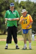 27 June 2011; Team Ireland golfer Michael O'Leary, Killarney, Co. Kerry, and his caddy Christopher Griffin, Rathfarnham, Dublin, line up a putt on the 16th during the qualifying rounds at the Glyfada Golf Course. 2011 Special Olympics World Summer Games, Athens, Greece. Picture credit: Ray McManus / SPORTSFILE