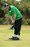 27 June 2011; Team Ireland golfer Michael O'Leary, Killarney, Co. Kerry, putting on the 16th green during the qualifying rounds at the Glyfada Golf Course. 2011 Special Olympics World Summer Games, Athens, Greece. Picture credit: Ray McManus / SPORTSFILE
