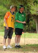 27 June 2011; Team Ireland's Gary Fleming, Monkstown, Co. Cork, with his his caddy Donal Deady, Bruree, Co. Limerick, as he prepares to apporach the 17th fairway during the qualifying rounds at the Glyfada Golf Course. 2011 Special Olympics World Summer Games, Athens, Greece. Picture credit: Ray McManus / SPORTSFILE