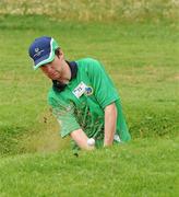 27 June 2011; Team Ireland's Gary Fleming, Monkstown, Co. Cork, plays from a green side bunker at the 17th during the qualifying rounds at the Glyfada Golf Course. 2011 Special Olympics World Summer Games, Athens, Greece. Picture credit: Ray McManus / SPORTSFILE