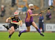 25 June 2011; Aoife Neary, Kilkenny, in action against Mary Leacy, Wexford. All-Ireland Senior Camogie Championship Round 3 in association with RTE Sport, Wexford v Kilkenny, Wexford Park, Co. Wexford. Picture credit: Barry Cregg / SPORTSFILE