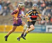 25 June 2011; Kate Kelly, Wexford, in action against Claire Phelan, Kilkenny. All-Ireland Senior Camogie Championship Round 3 in association with RTE Sport, Wexford v Kilkenny, Wexford Park, Co. Wexford. Picture credit: Barry Cregg / SPORTSFILE