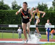 26 June 2011; Conor McGuinness, from Clonliffe Harriers A.C., Dublin, in action in the U23 Men's 3000m Steeplechase race during the Woodie’s DIY Junior and U23 Championships. Tullamore Harriers AC, Tullamore, Co. Offaly. Picture credit: Barry Cregg / SPORTSFILE