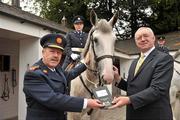 27 June 2011; Garda Commissioner Martin Callinan, left, with Joe Walsh, Chairman, Horse Sport Ireland and Garda Lisa Halligan, Mounted Unit, pictured at the Hand-over of Embarr, sponsored by HSI to the Garda Mounted Unit. Garda Mounted Unit, Phoenix Park, Dublin. Picture credit: David Maher / SPORTSFILE