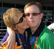 27 June 2011; Team Ireland's Peter Oxley, Tyrrelspass, Co. Westmeath, who won a Bronze Medal in a 100m Backstroke Final is congratulated by his mother Chris at the OAKA Olympic Aquatic Center, Athens Olympic Sport Complex. 2011 Special Olympics World Summer Games, Athens, Greece. Picture credit: Ray McManus / SPORTSFILE