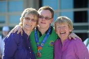 27 June 2011; Team Ireland's Peter Oxley, Tyrrelspass, Co. Westmeath, who won a Bronze Medal in a 100m Backstroke Final is congratulated by his mother Chris, left, and aunt Mary Gardiner at the OAKA Olympic Aquatic Center, Athens Olympic Sport Complex. 2011 Special Olympics World Summer Games, Athens, Greece. Picture credit: Ray McManus / SPORTSFILE