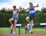 26 June 2011; Noel Collins, right, from Finn Valley A.C., on his way to finishing in second place, jumps the water jump with Emmet Jennings, left, from Dundrum South Dublin, who finished in third place in the U23 Men's 3000m Steeplechase race during the Woodie’s DIY Junior and U23 Championships. Tullamore Harriers AC, Tullamore, Co. Offaly. Picture credit: Barry Cregg / SPORTSFILE