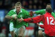 2 February 2002; Roger Wilson of Ireland is tackled by Hal Luscombe of Wales during the U21 International match between Ireland and Wales at Donnybrook Stadium in Dublin. Photo by Matt Browne/Sportsfile