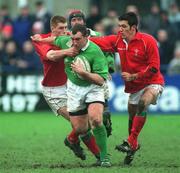 2 February 2002; Sean Phillips of Ireland, is tackled by Bryn Griffiths, left and Liam Roberts, right, of Wales during the U21 International match between Ireland and Wales at Donnybrook Stadium in Dublin. Photo by Matt Browne/Sportsfile