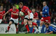 26 January 2002; Anthony Horgan of Munster goes past the tackle of Nathan Williams of Stade Francais on his way to scoring his sides first try during the Heineken Cup Quarter-Final match between Stade Francais and Munster at Stade Jean-Boudin in Paris, France. Photo by Matt Browne/Sportsfile