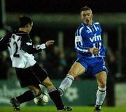 7 February 2002; John White of Dundalk in action against Kevin McHugh of Finn Harps during the FAI Carlsberg Cup Quarter-Final match between Dundalk and Finn Harps at Oriel Park in Dundalk, Louth. Photo by David Maher/Sportsfile