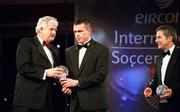 10 February 2002; Barry Porter of Letterkenny Rovers, Intermediate Award winner, receives his trophy from President of the FAI Milo Corcoran, watched by eircom Chief Executive, Dr. Phil Nolan, right, during the eircom International Soccer Awards at Citywest Hotel in Saggart, Dublin. Photo by David Maher/Sportsfile