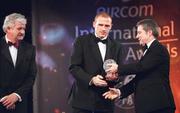10 February 2002; Glen Crowe of Bohemians and eircom League Award winner, receives his award from eircom Chief Executive, Dr. Phil Nolan, right, and President of the FAI Milo Corcoran during the eircom International Soccer Awards at Citywest Hotel in Saggart, Dublin. Photo by David Maher/Sportsfile