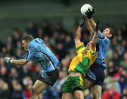 10 February 2002; Darren Magee of Dublin wins possession from Mark Crossan of Donegal, alongside Ciaran Whelan of Dublin, left, during the Allianz National Football League Division 1A Round 1 match between Dublin and Donegal at Parnell Park in Dublin. Photo by Ray McManus/Sportsfile