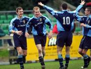 10 February 2002; Michael O'Donnell of UCD, second from left, celebrates with team-mates, from left, Ted O'Connor, Alan McNally and Robert Martin after scoring his sides second goal during the FAI Carlsberg Cup Quarter-Final match between UCD and Derry City at Belfield Park in Dublin. Photo by David Maher/Sportsfile