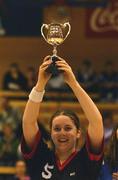 11 February 2002; Holy Faith captain Lisa O'Connor lifts the cup after her side's victory in the Bank of Ireland Schools Cup U16 &quot;B&quot; Girls Final match between Holy Faith, Clontarf, Dublin, and Glanmire Community College, Cork, at the ESB Arena in Tallaght, Dublin. Photo by Brendan Moran/Sportsfile
