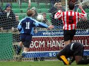 10 February 2002; Michael O'Donnell of UCD, scores his sides second goal, after a mistake by Derry City goalkeeper Russell Payne, during the FAI Carlsberg Cup Quarter-Final match between UCD and Derry City at Belfield Park in Dublin. Photo by David Maher/Sportsfile